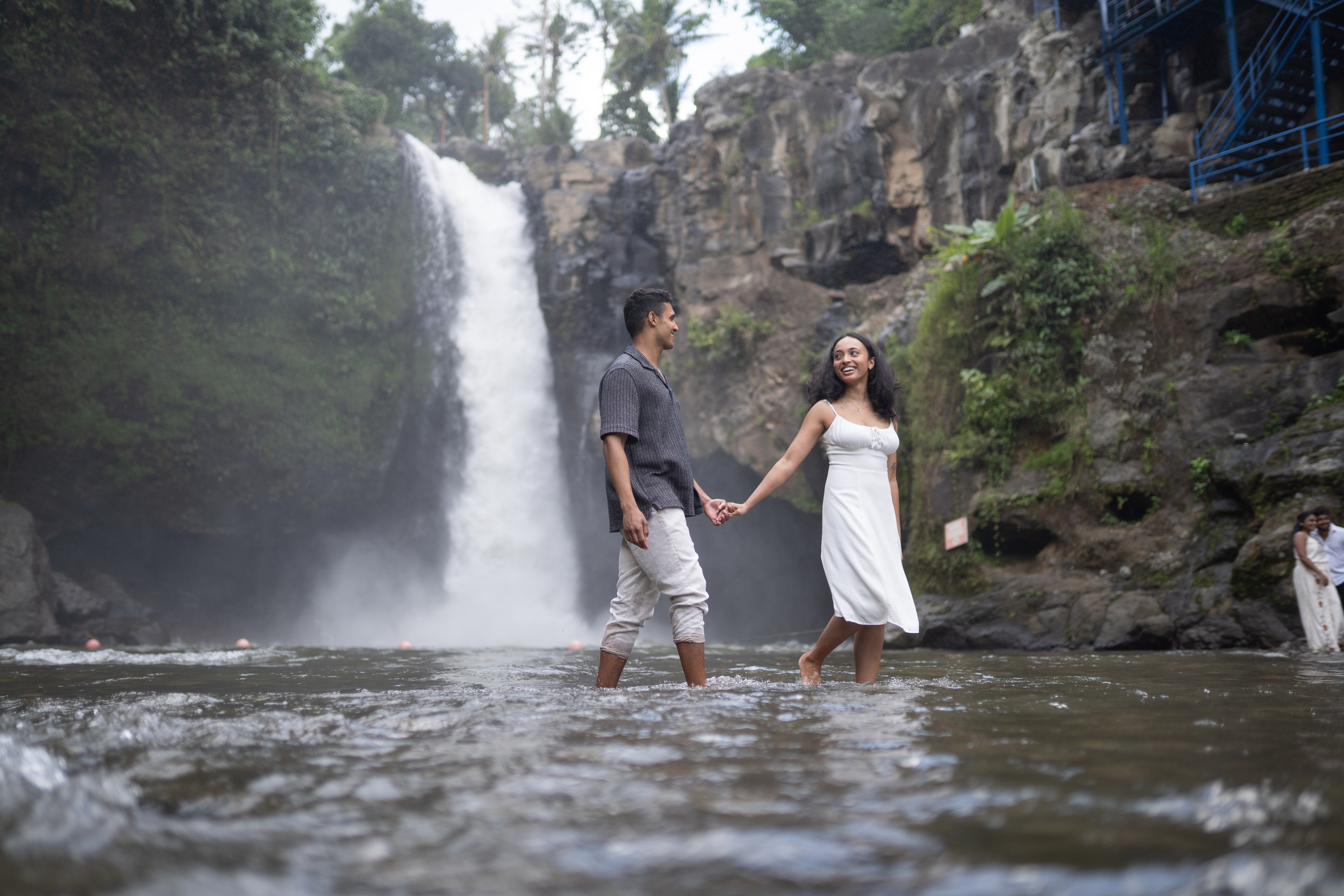 Arry and Michell at a waterfall — a moment on the path ahead